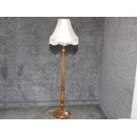 Oak pedestal standard lamp & fringed shade