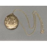 A 9ct yellow gold locket on 9ct yellow gold chain 9.8g gross