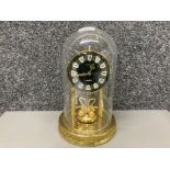 A Heittich anniversary clock with glass dome 30cm high
