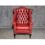 Oxblood leather Chesterfield wing back armchair