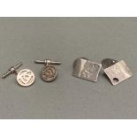 Two pairs of silver cufflinks of different designs