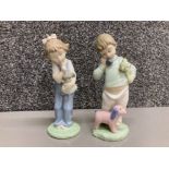 Nao by Lladro: Boy on phone with puppets no 1044 and girl with doll