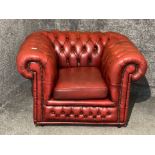 An ox blood leather chesterfield tub chair