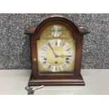 A Tempus mantle clock in mahogany case, with key