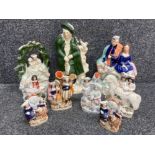 A collection of 19th century Staffordshire pottery figures and spill vases (damages)