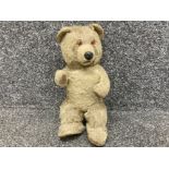 A vintage teddy bear with wind up mechanism (needs attention)