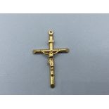 9ct Gold Crucifix Pendant measuring approximately 5cm x 2.5cm and weighing 1.8 grams