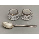 A pair of early 20th century salts with silver rims and a silver teaspoon 20.8g
