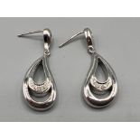 Ladies 9ct white gold diamond drop earrings. Each set with 5 round brilliant cut diamonds 4g