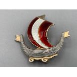 A Norwegian silver and enamel brooch in the form of a Viking ship by Askell Holmsen Sandefjord