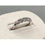 18ct white gold 5 white stone ring. Comprising of 5 round cut stones in claw settings. Size M 3.2g