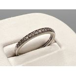 Ladies 9ct white gold diamond band. Comprising of 21 round brilliant cut diamonds 1.7g size N