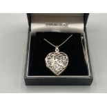 A silver heart shaped locket on silver chain 7.1g