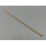 Ladies 9ct gold ornate diamond bracelet. Comprising of 42 round brilliant cut diamonds set around