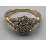 A 9ct yellow gold diamond cluster ring 3.2g size M 1/2