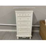 A white painted chest of tall drawers 72 x 131 x 41.5cm