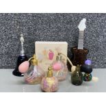 7 coloured glass perfume bottles (1 with contents) including Caithness & Murano, also includes a