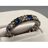 Ladies 18ct white gold blue and white stone full eternity ring. Comprising of 9 blue stones and 9 cz