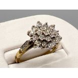 Ladies 9ct gold diamond cluster ring. Comprising of 21 round brilliant cut diamonds and 3 set on