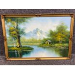 Gilt framed oil on canvas “cabin by the lake” signed bottom right, 89x59cm