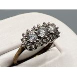 Ladies 9ct gold cz cluster ring. Comprising of 3 round cut stones with a halo setting. 2.8g size N