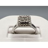 Ladies 9ct white gold diamond cluster halo ring. Featuring 4 Princess cut diamonds surrounded by