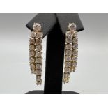 9ct gold cz set drop earrings. Comprising of 17 cz stones in each earring complete with butterfly
