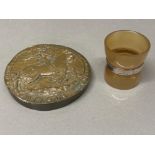 A Victorian horn egg cups with silver band, and a resin circular plaque