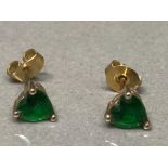 A pair of 9ct yellow gold and heart shaped green stone stud earrings