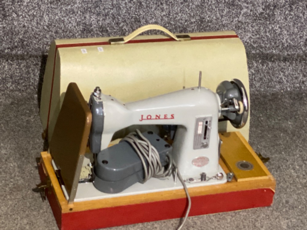 Vintage Jones sewing machine with original carry case