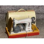 Vintage Jones sewing machine with original carry case