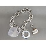 Sterling silver bracelet in box with 'pulling pants' fob to one end plus ring & faux padlock