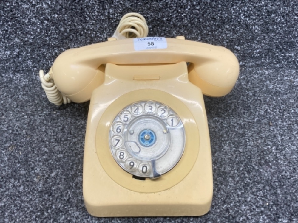 A vintage telephone in cream