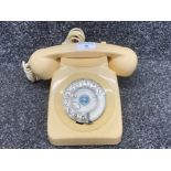 A vintage telephone in cream