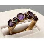 Antique ladies 9ct gold amethyst and opal ring. Comprising of 4 round amethyst stone with 6 opals