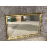 A modern bevelled wall mirror in gilt frame 71 x 101cm