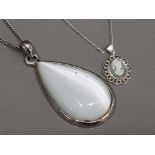 Silver jasper cameo pendant on silver chain together with a white metal & white stone teardrop