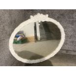 A large modern mirror with white swept frame 106 x 126cm