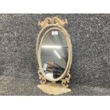 A shabby chic metal swing mirror