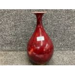 A Chinese Sang de Boeuf bottle vase with character stamp to base 33cm high