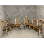 A set of six Ercol dining chairs 2 + 4