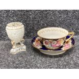 A Coalport style 19th century teacup and saucer and a small reticulated porcelain urn