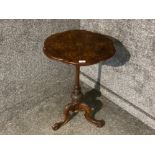 A Victorian burr walnut occasional table with decorative inlaid top raised on tripod feet