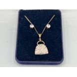 Silver gilt handbag pendant necklace accompanied by silver 925 cz stud earrings