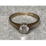 A 9ct yellow gold and diamond solitaire ring stamped .50 size M1/2 1.7g gross