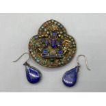 A pair of white metal And blue stone drop earrings together with a multi-stone brooch depicting an