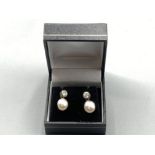 A pair of silver CZ and freshwater Pearl drop earrings