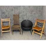 Four chairs to include a rattan dining chair, two folding teak and tub chair