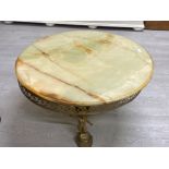 Large circular shaped onyx top coffee table on figured brass and onyx base