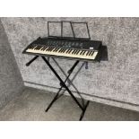 Yamaha PSR-19 electric keyboard on stand